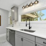 a kitchen with white cabinets