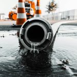 water coming out from gray pipe