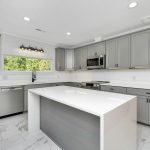 a kitchen with white cabinets